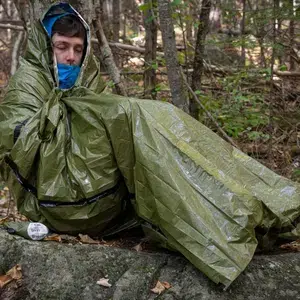 Emergency_Bivvy_OD_Green_man_in_bivvy_in_fall