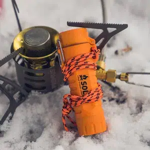 Fire_Lite_Fuel_Free_Lighter_leaning_on_stove_in_snow