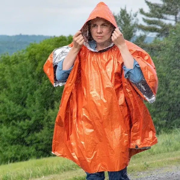 Heat_Reflective_Poncho_in_use_woman_in_rain