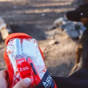 Scout_Survival_Kit_in_hand_near_dog